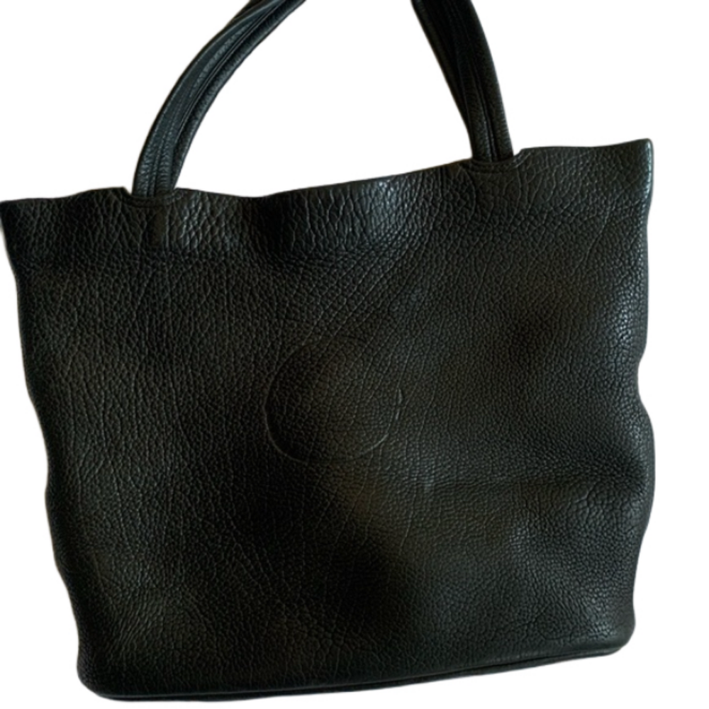 Leather tote unknown brand.  Woman/man unisex